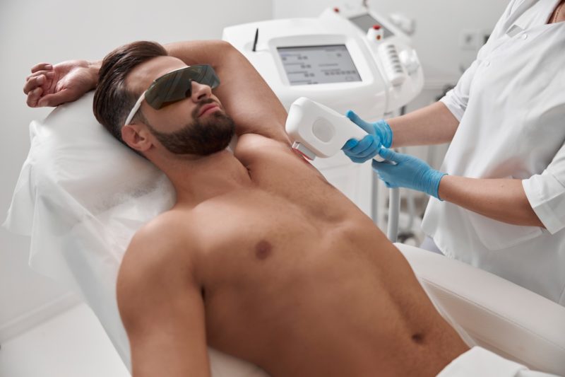 Man,With,Goggles,And,Bare,Chest,Undergoes,Procedure,Of,Arm